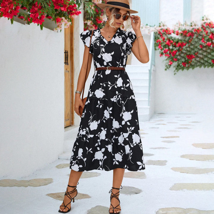 "Women's black midi dress with V-neck, floral print, side view"
