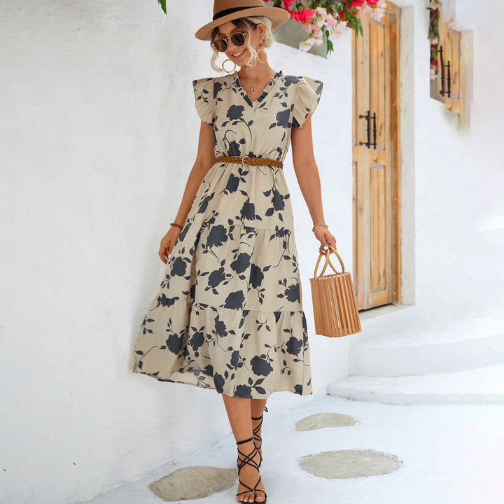 "Women's black midi dress with V-neck, floral print, side view"