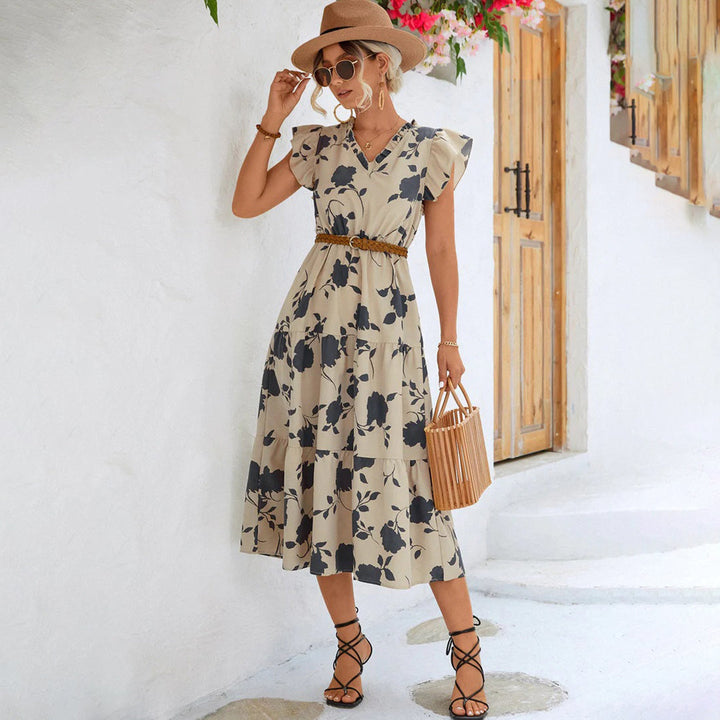 "Women's black midi dress with V-neck, floral print, side view"