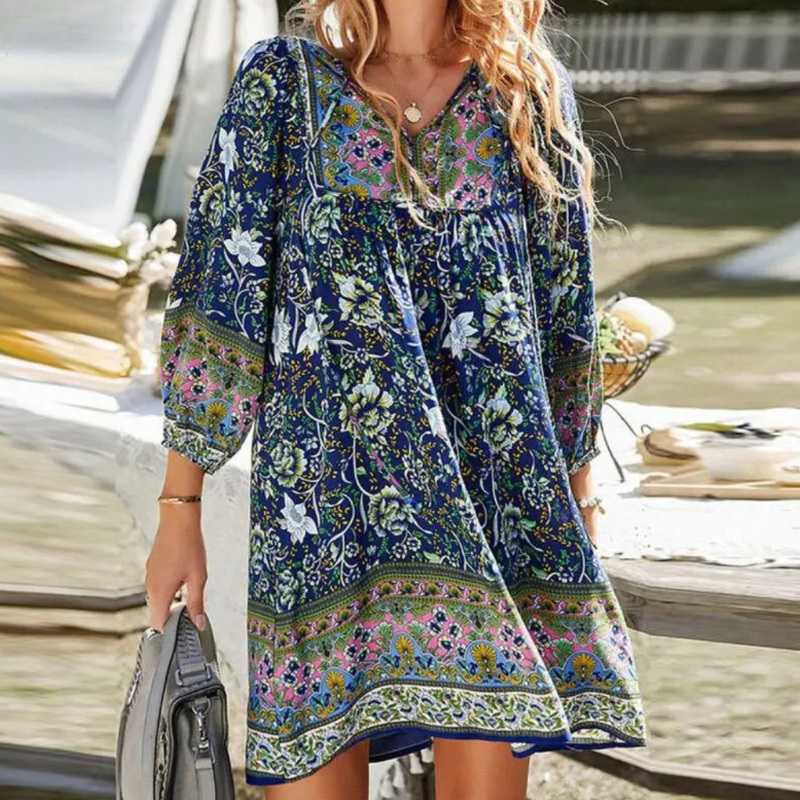 "Women's boho floral summer dress, knee-length, long sleeves, relaxed fit, perfect for sunny days."