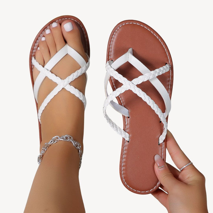 Women's braided orthopedic flat sandals with chic braided straps and ergonomic footbed, ideal for comfort and summer style.