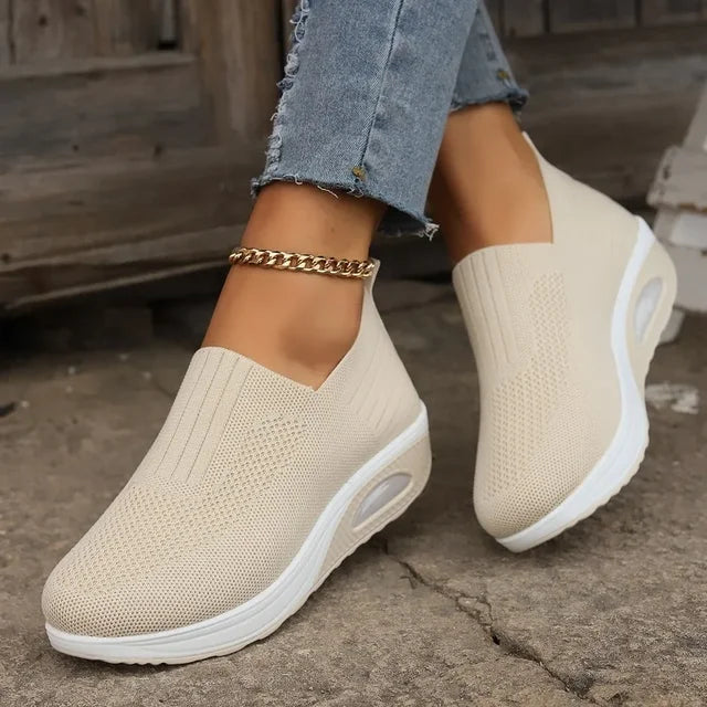 Women's breathable slip-on sneakers with cushioned sole, featuring lightweight mesh upper for cool, everyday comfort.