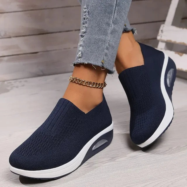 Women's breathable slip-on sneakers with cushioned sole, featuring lightweight mesh upper for cool, everyday comfort.