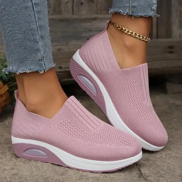Women's breathable slip-on sneakers with cushioned sole, featuring lightweight mesh upper for cool, everyday comfort.