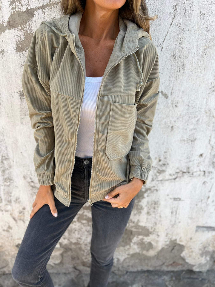 Women's casual hooded zip-up jacket, versatile and comfortable, featuring a zipper closure and a stylish design for women.