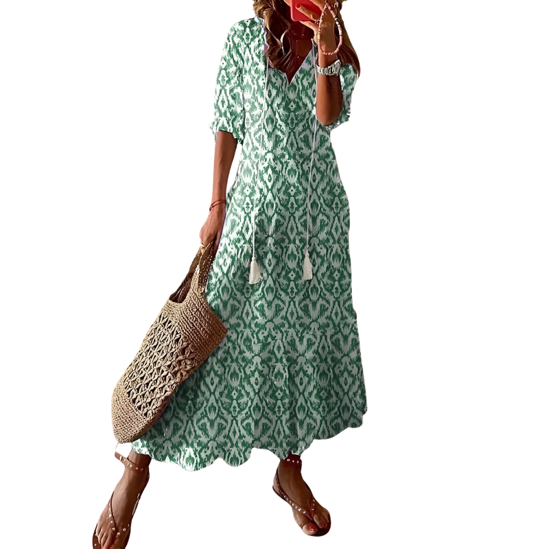 "Women's chic bohemian long dress in vibrant colors, ideal for beachwear with floral patterns and flowing silhouette."