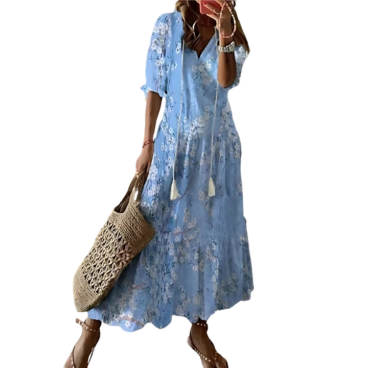 "Women's chic bohemian long dress in vibrant colors, ideal for beachwear with floral patterns and flowing silhouette."