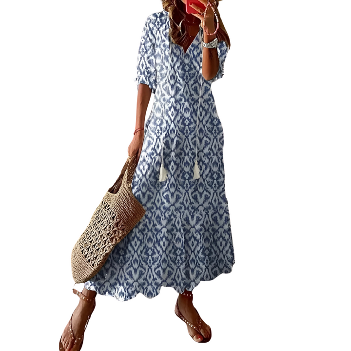 "Women's chic bohemian long dress in vibrant colors, ideal for beachwear with floral patterns and flowing silhouette."