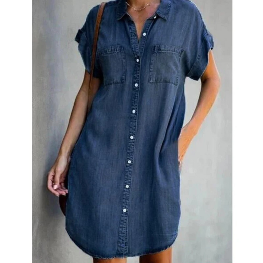 Women's denim short sleeve shirt dress with button-down front, relaxed fit, and chest pockets for a casual yet elegant look.