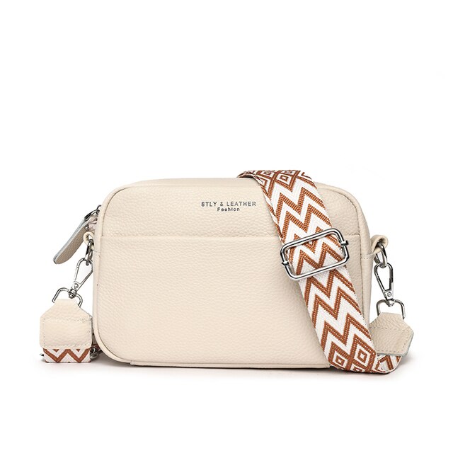 "Women's elegant beige leather crossbody bag with pebbled texture and adjustable strap, perfect for versatile fashion styling