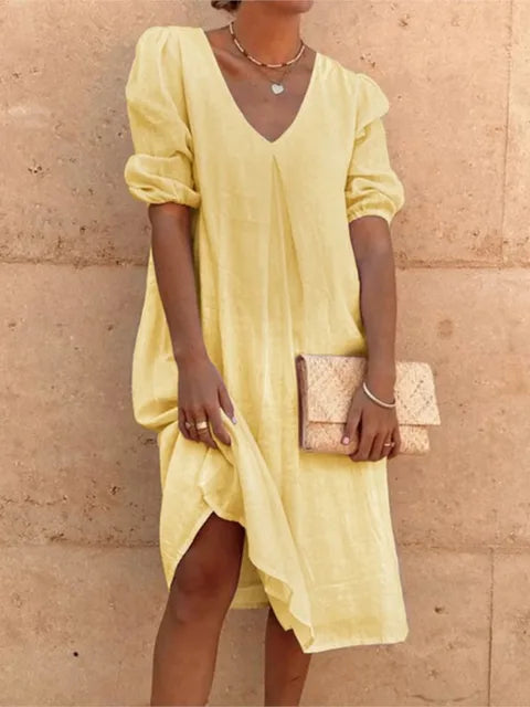 Women's elegant casual midi dress in black, flattering fit, with versatile styling and bubble sleeves, perfect for summer.