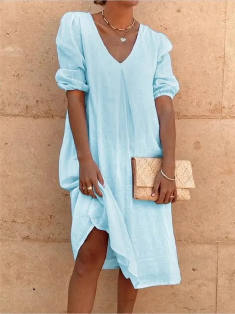 Women's elegant casual midi dress in black, flattering fit, with versatile styling and bubble sleeves, perfect for summer.