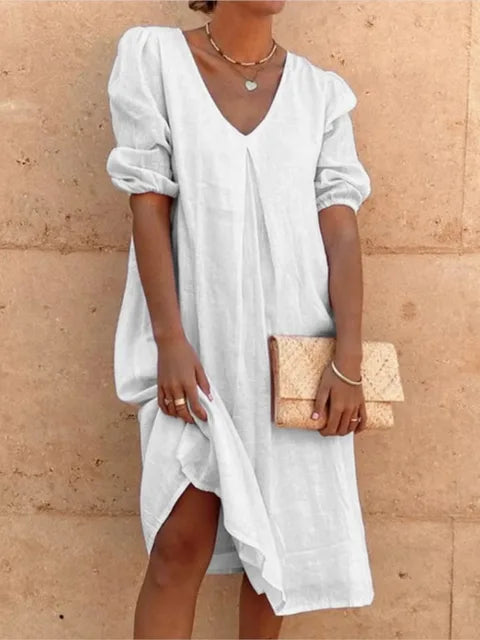 Women's elegant casual midi dress in black, flattering fit, with versatile styling and bubble sleeves, perfect for summer.