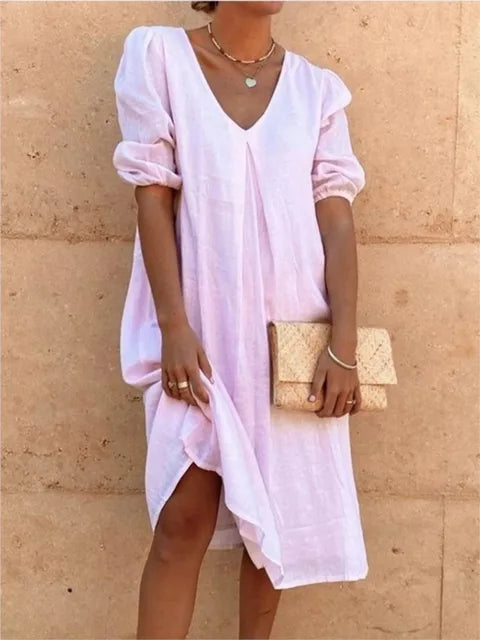 Women's elegant casual midi dress in black, flattering fit, with versatile styling and bubble sleeves, perfect for summer.