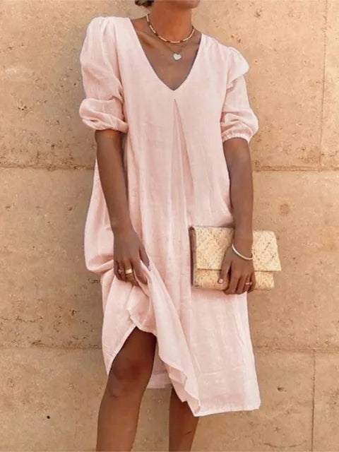 Women's elegant casual midi dress in black, flattering fit, with versatile styling and bubble sleeves, perfect for summer.