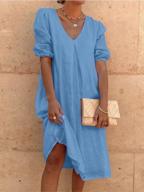 Women's elegant casual midi dress in black, flattering fit, with versatile styling and bubble sleeves, perfect for summer.