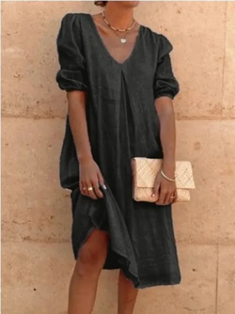 Women's elegant casual midi dress in black, flattering fit, with versatile styling and bubble sleeves, perfect for summer.