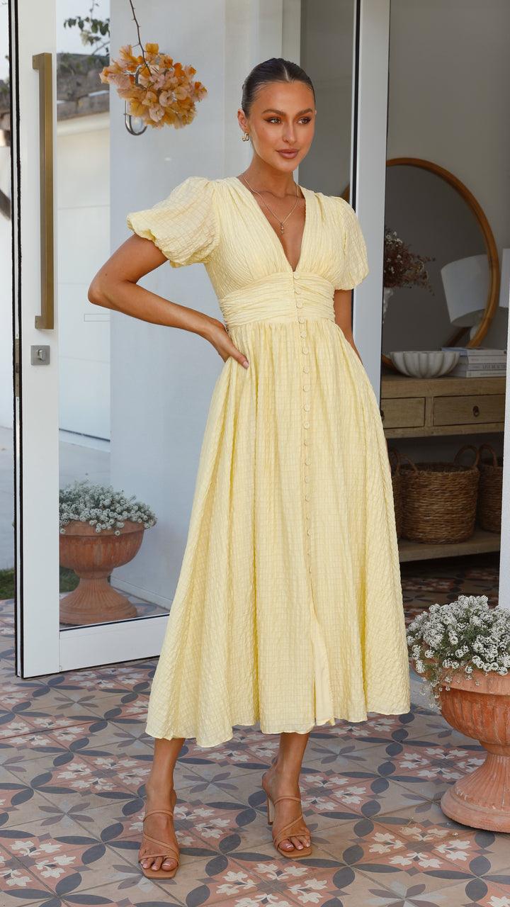 Women's elegant flowy maxi dress with button-front, showcasing a graceful silhouette ideal for versatile fashion wear.