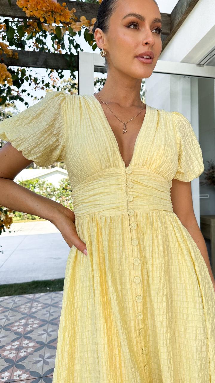Women's elegant flowy maxi dress with button-front, showcasing a graceful silhouette ideal for versatile fashion wear.
