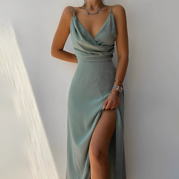 "Women's elegant long dress, plunging neckline, sleek silhouette, perfect for formal events or evening outings."