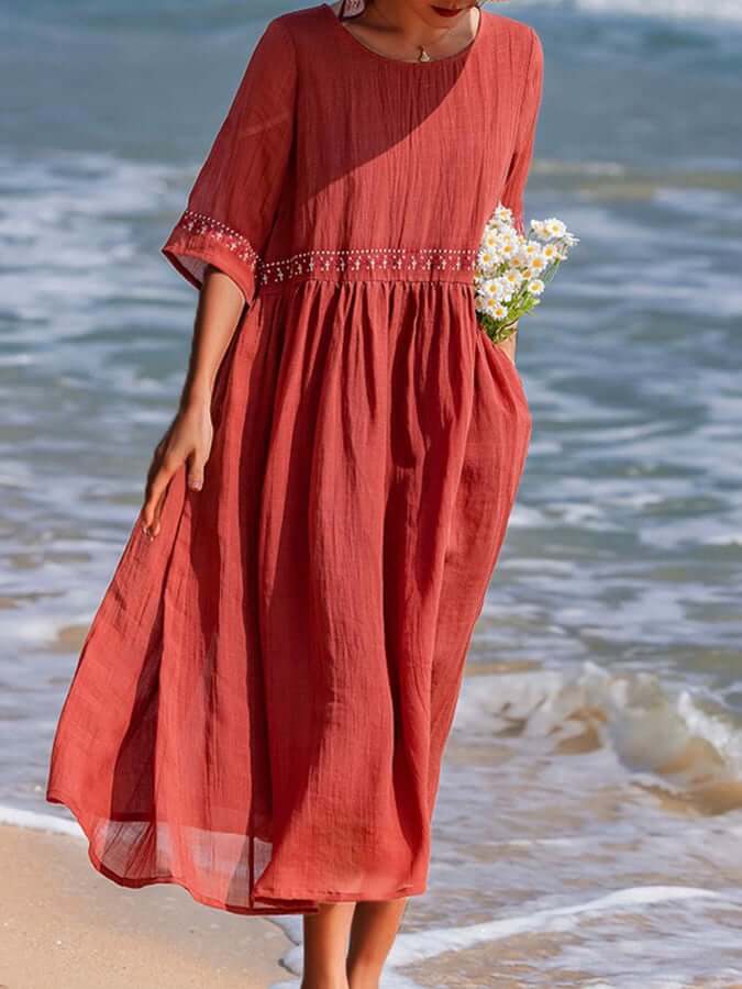 "Women's embroidered loose dress with cotton linen blend, intricate embroidery detailing, comfortable and elegant look."