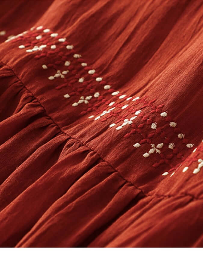 "Women's embroidered loose dress with cotton linen blend, intricate embroidery detailing, comfortable and elegant look."