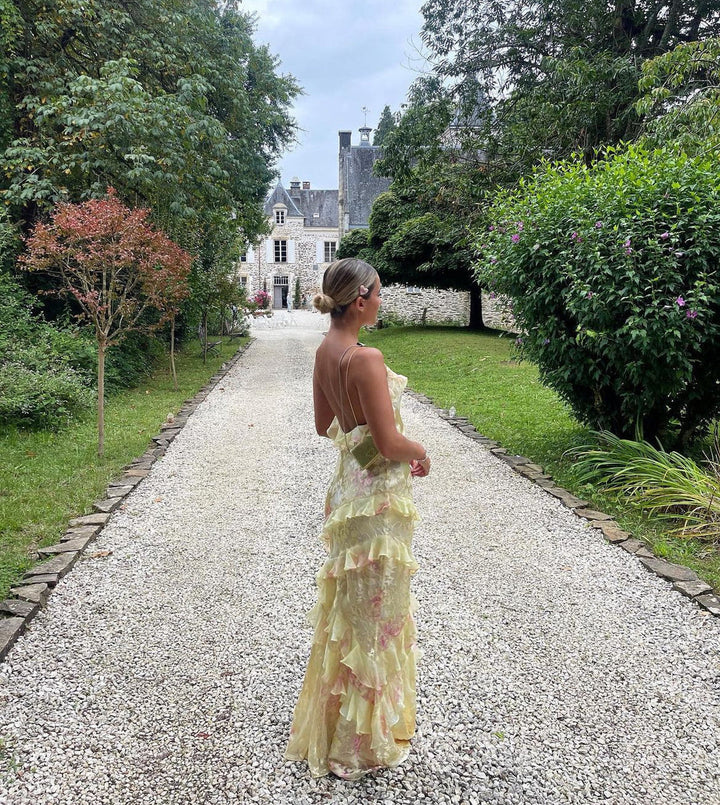 "Women's ethereal ruffle maxi dress, romantic flowing design, airy ruffles, open-back detail, soft romantic hues for elegance