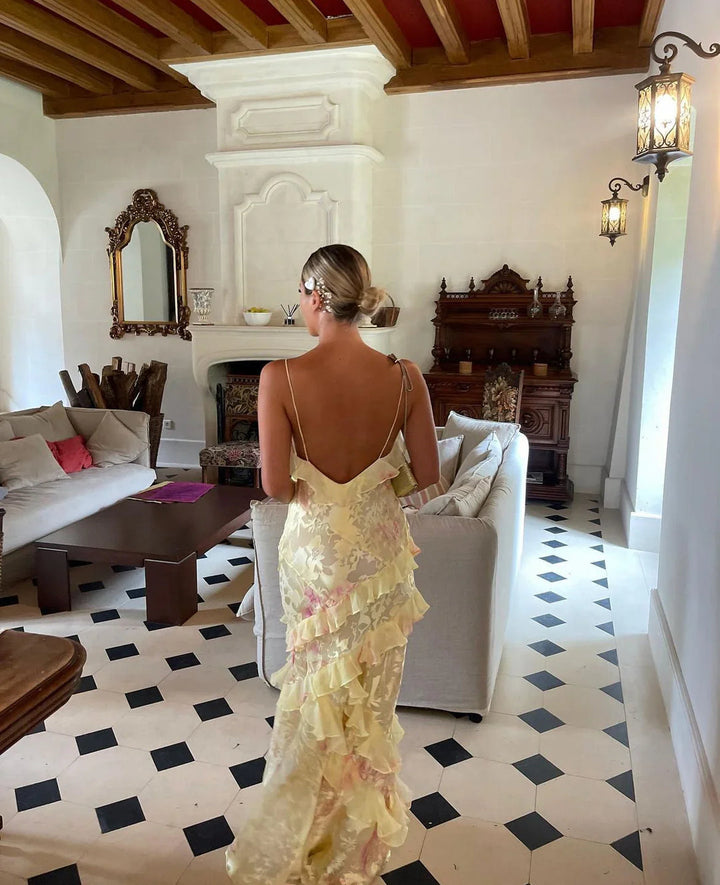 "Women's ethereal ruffle maxi dress, romantic flowing design, airy ruffles, open-back detail, soft romantic hues for elegance