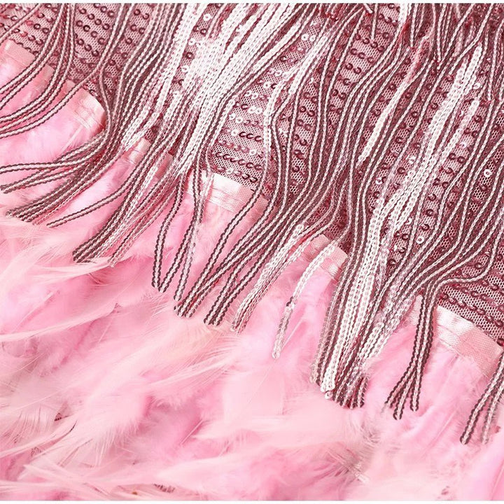 "Women's feather mini dress with elegant detailing, chic silhouette and luxurious feather accents for special occasions."