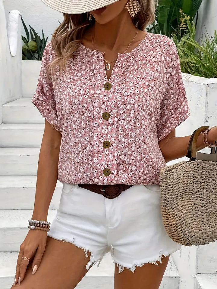 "Women's floral button-front casual blouse, short-sleeve, loose fit, charming print ideal for sunny days, versatile style."