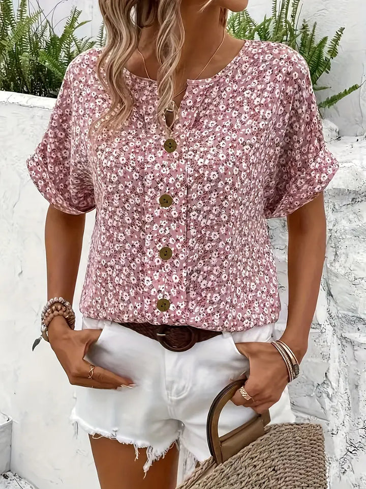 "Women's floral button-front casual blouse, short-sleeve, loose fit, charming print ideal for sunny days, versatile style."