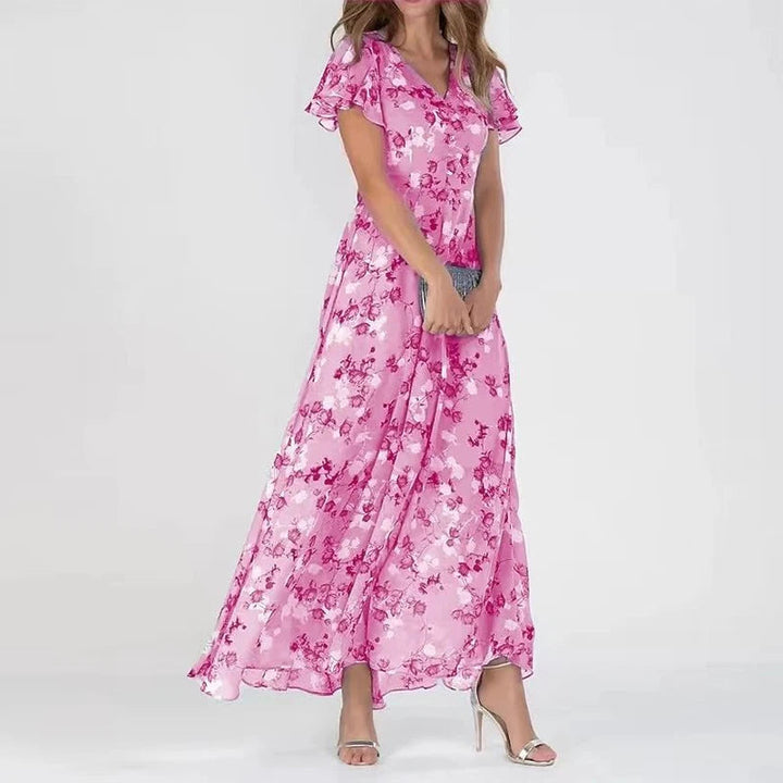 "Women's floral print maxi dress with V-neck, flutter sleeves, and flowy silhouette perfect for garden parties or weddings."