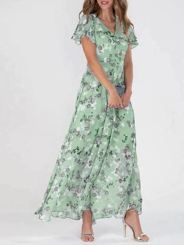 "Women's floral print maxi dress with V-neck, flutter sleeves, and flowy silhouette perfect for garden parties or weddings."