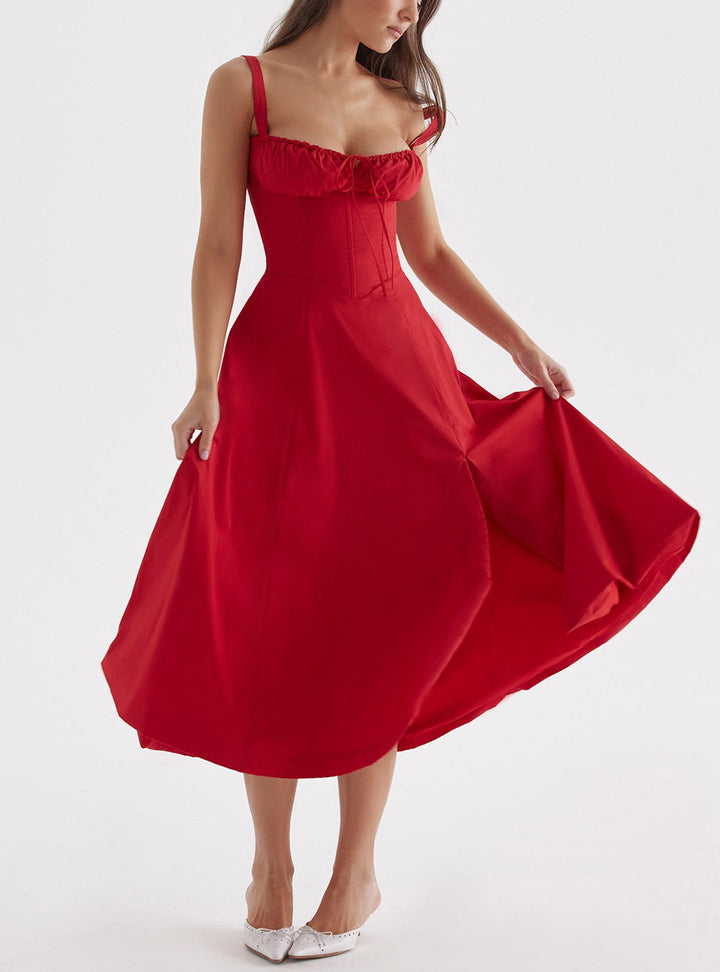 "Women's floral print sleeveless midi dress with tie front, chic design with flared fit, perfect for sunny days."