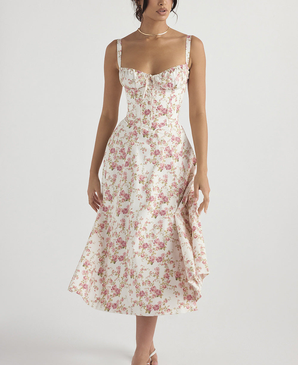 "Women's floral print sleeveless midi dress with tie front, chic design with flared fit, perfect for sunny days."