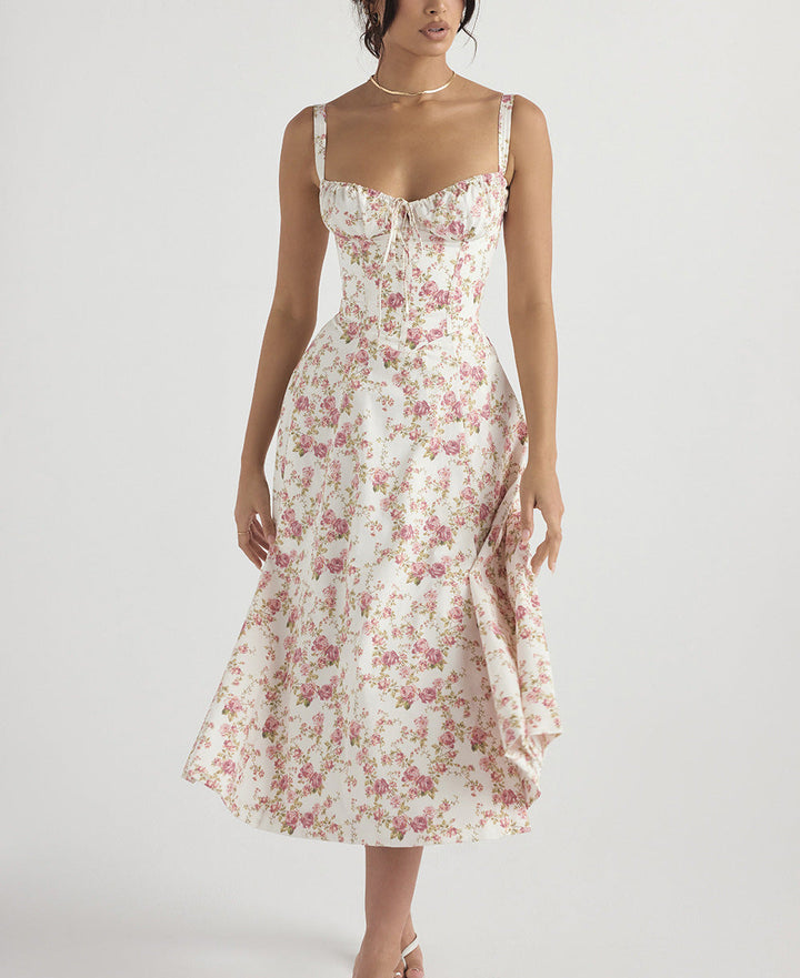 "Women's floral print sleeveless midi dress with tie front, chic design with flared fit, perfect for sunny days."