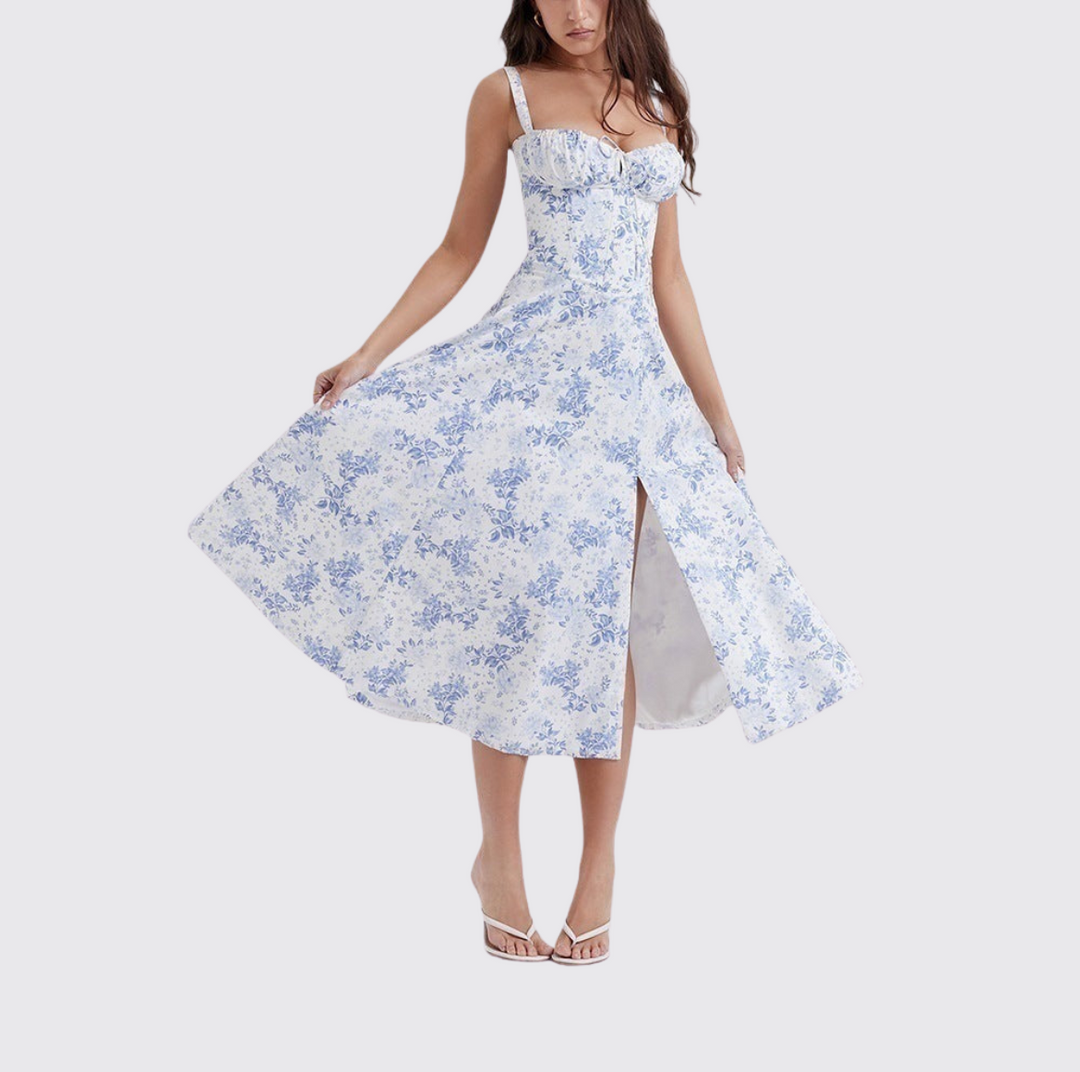 "Women's floral print sleeveless midi dress with tie front, chic design with flared fit, perfect for sunny days."