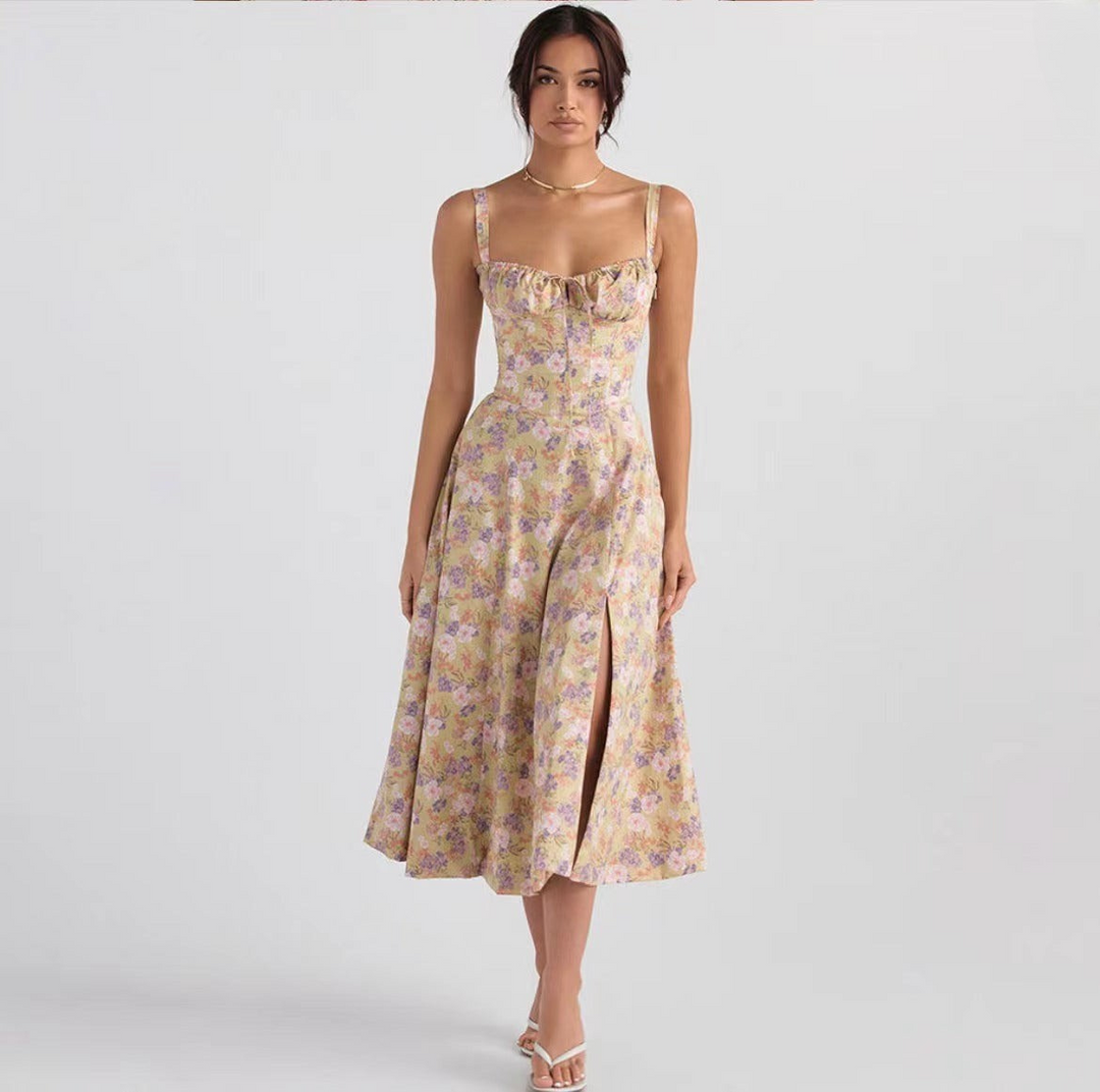 "Women's floral print sleeveless midi dress with tie front, chic design with flared fit, perfect for sunny days."