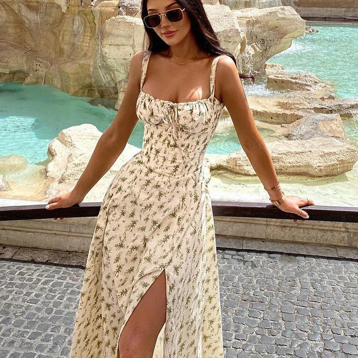 "Women's floral print sleeveless midi dress with tie front, chic design with flared fit, perfect for sunny days."
