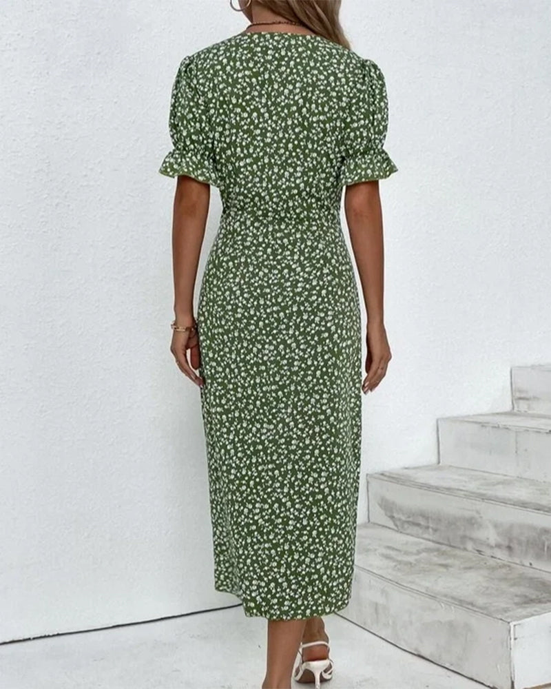 Women's floral wrap-style midi dress with V-neck and puff sleeves, perfect for warm days and stylish outings.