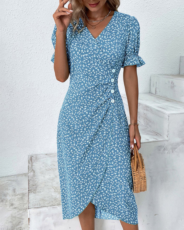 Women's floral wrap-style midi dress with V-neck and puff sleeves, perfect for warm days and stylish outings.