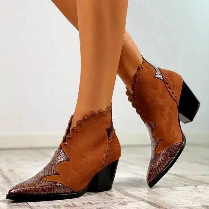 "Women's genuine leather lace-up cowboy boots with a classic Western design, pointed toe, and traditional silhouette."