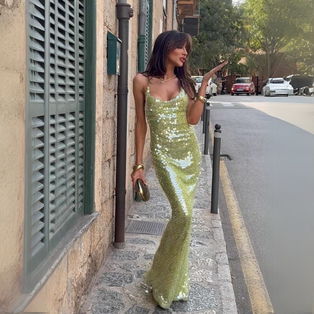 Women's green sequin maxi dress with spaghetti straps, shimmering effect, elegant fit, ideal for formal events.