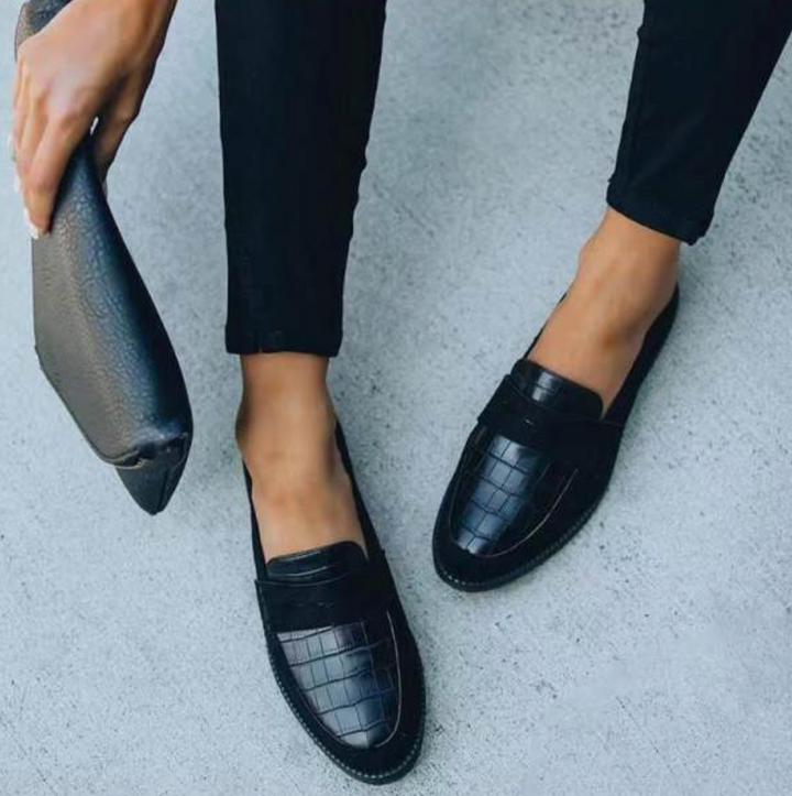 Women's leather loafers with classic silhouette, sleek design, and cushioned insoles for unmatched comfort and elegance.