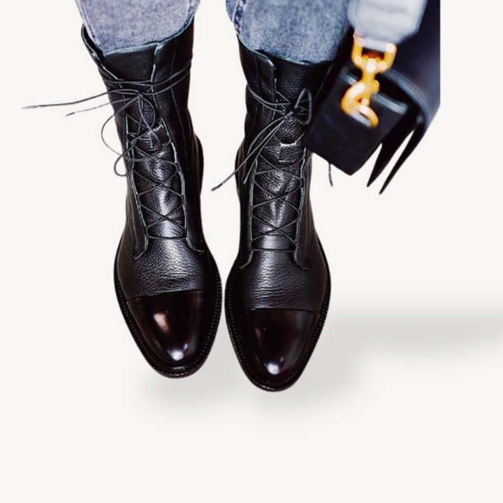 Women's leather orthopedic combat ankle boots in black and brown, lace-up design, providing style and foot support.