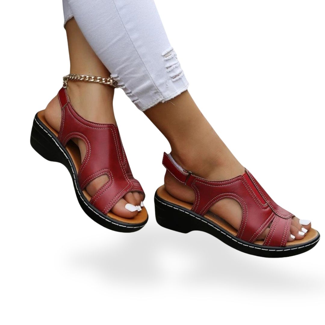 Women's leather orthopedic sandals with adjustable straps, available in black, red, white, brown; comfortable and stylish des