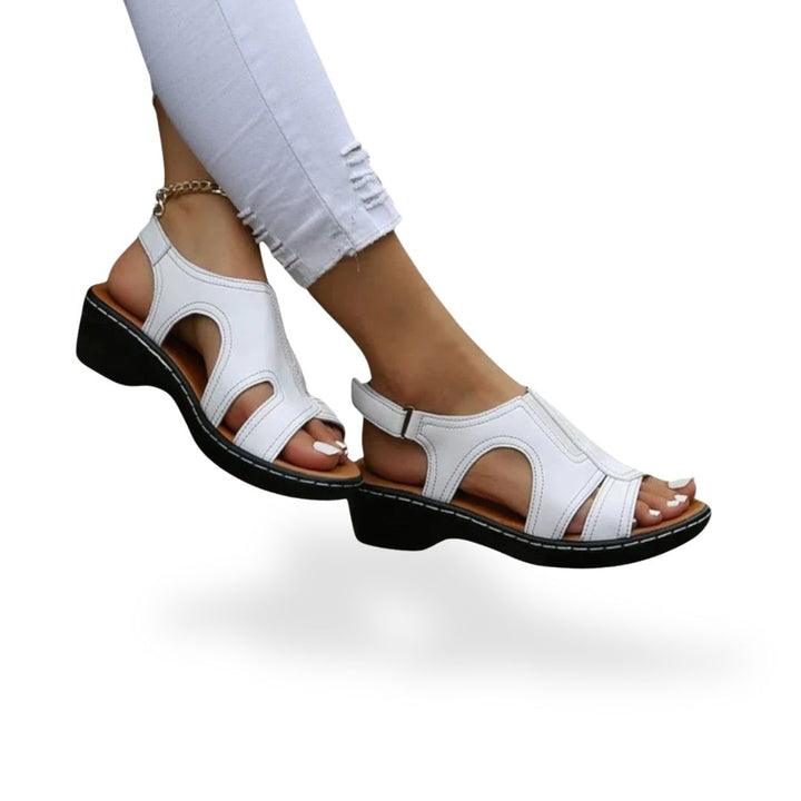 Women's leather orthopedic sandals with adjustable straps, available in black, red, white, brown; comfortable and stylish des