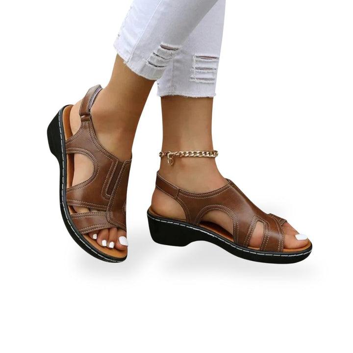 Women's leather orthopedic sandals with adjustable straps, available in black, red, white, brown; comfortable and stylish des