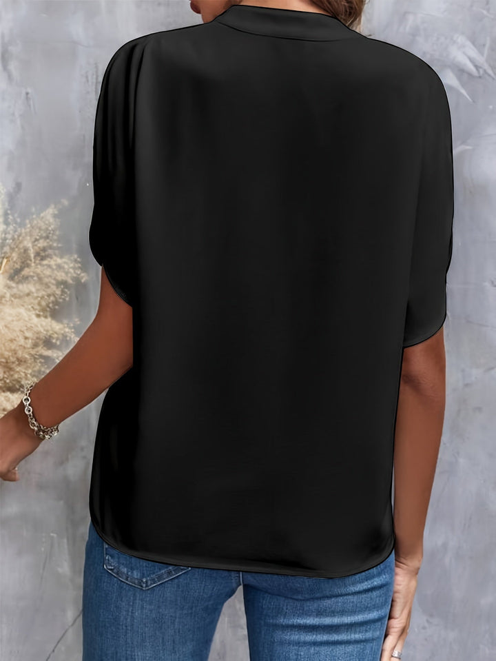 "Women's lightweight elegant blouse with soft drape, relaxed fit, and classic collar, ideal for casual or formal wear."