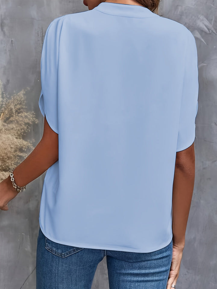 "Women's lightweight elegant blouse with soft drape, relaxed fit, and classic collar, ideal for casual or formal wear."